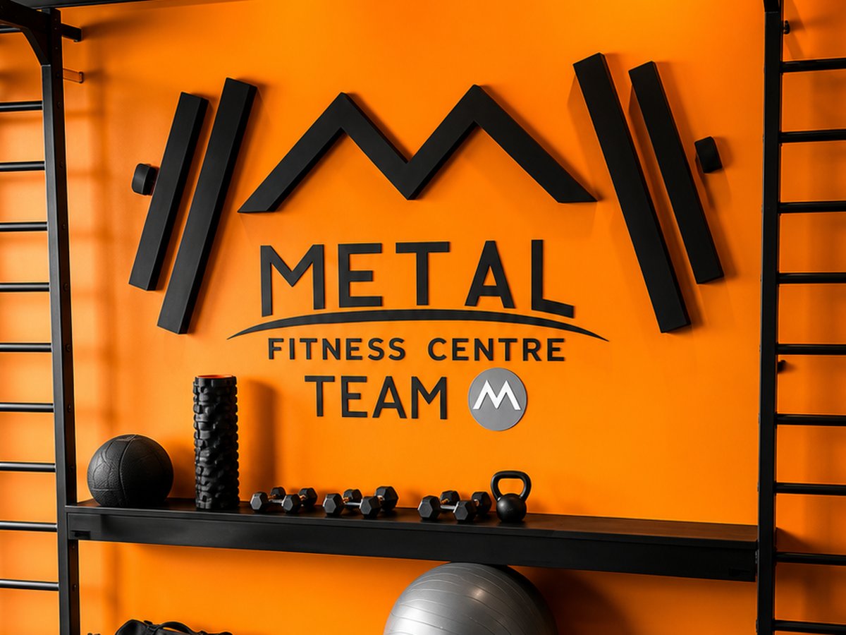 The Metal Fitness Centre logo wall inside the gym