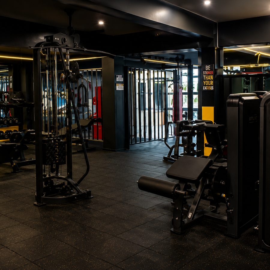 Gym floor with motivational wall signs and machines