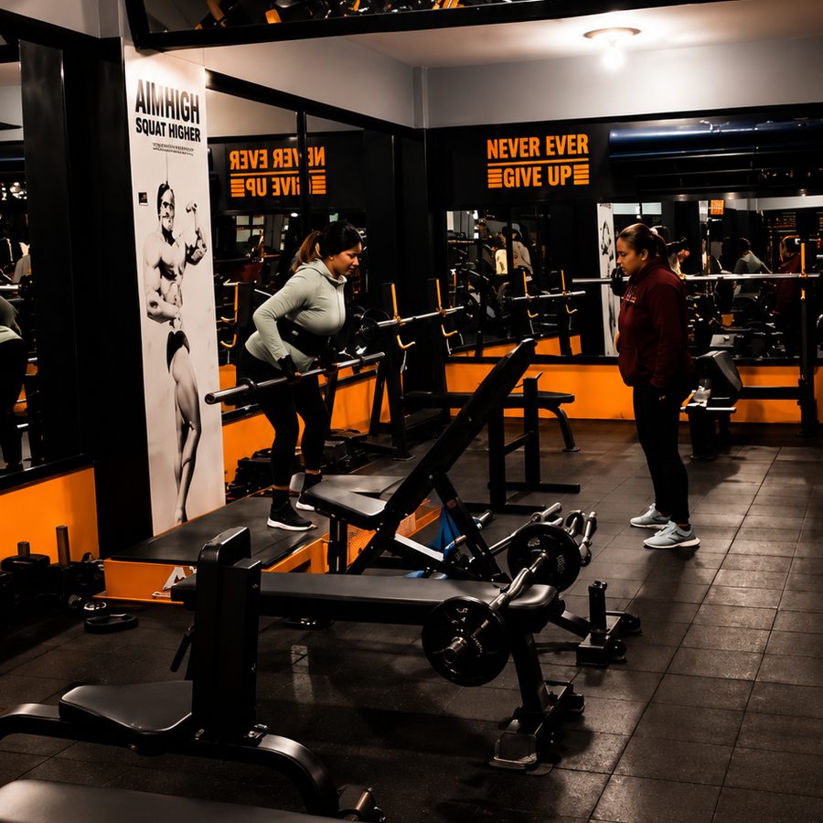 Squat rack area with motivational posters